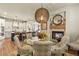 Dining area featuring a table near the fireplace with open access to the well-equipped kitchen space at 10828 Valleybrook Cir, Highlands Ranch, CO 80130