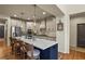 A kitchen featuring an island with bar stool seating, modern stainless steel appliances, and beautiful pendant lighting at 10828 Valleybrook Cir, Highlands Ranch, CO 80130