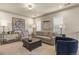 Living room showcasing neutral-colored furniture, decorative lamps, and artwork at 10828 Valleybrook Cir, Highlands Ranch, CO 80130