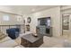 Cozy loft area featuring a TV, comfortable seating, and stylish decor with lots of natural light at 10828 Valleybrook Cir, Highlands Ranch, CO 80130
