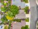 Aerial view of a home showcasing a well-maintained roof, mature trees, and a charming backyard at 12193 Deerfield Way, Broomfield, CO 80020