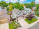 Aerial view showcasing house in residential neighborhood with mature trees at 12193 Deerfield Way, Broomfield, CO 80020