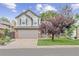 Charming two-story home with a two-car garage, brick accents, and a well-manicured front lawn at 12193 Deerfield Way, Broomfield, CO 80020