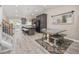 Open-concept kitchen featuring gray cabinets, an island with seating, and modern appliances at 12193 Deerfield Way, Broomfield, CO 80020