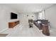 Bright living room with a fireplace, large TV, and comfortable seating at 12193 Deerfield Way, Broomfield, CO 80020