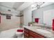 Bathroom with shower-tub combination, cherry-wood vanity, and granite countertops at 750 S Alton Way # 4B, Denver, CO 80247