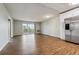 Open concept kitchen with stainless steel appliances and hardwood floors at 750 S Alton Way # 4B, Denver, CO 80247