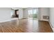 Bright living room with hardwood floors and sliding glass door to balcony at 750 S Alton Way # 4B, Denver, CO 80247