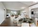 Open-concept living room and dining area with modern decor and great natural light at 750 S Alton Way # 4B, Denver, CO 80247