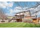 Well-maintained backyard featuring a large deck and a lush green lawn, perfect for outdoor enjoyment at 20087 E Dartmouth Dr, Aurora, CO 80013