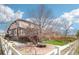 Expansive backyard features a patio with built-in seating and a wooden deck with stairs at 20087 E Dartmouth Dr, Aurora, CO 80013