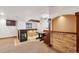 Finished basement with a bar area, fireplace, and built-in seating at 20087 E Dartmouth Dr, Aurora, CO 80013