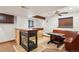 Finished basement featuring a bar, fireplace, and cozy dining area at 20087 E Dartmouth Dr, Aurora, CO 80013