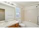 Well-lit bathroom featuring a vanity, mirror, and combined tub and shower at 20087 E Dartmouth Dr, Aurora, CO 80013