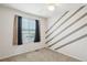 Comfortable bedroom with neutral-toned walls, carpet, and a bright window at 20087 E Dartmouth Dr, Aurora, CO 80013