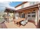 Inviting backyard deck with comfortable seating and an outdoor dining area at 20087 E Dartmouth Dr, Aurora, CO 80013