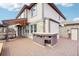Spacious deck featuring an outdoor bar area, seating, and access to the backyard at 20087 E Dartmouth Dr, Aurora, CO 80013