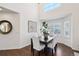 Dining area features white-cushioned chairs and a decorative light fixture at 20087 E Dartmouth Dr, Aurora, CO 80013