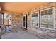 Charming front porch detailed with brick and includes windows for a great view at 20087 E Dartmouth Dr, Aurora, CO 80013