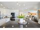 Well-lit kitchen featuring a large island with dark countertops and modern appliances at 20087 E Dartmouth Dr, Aurora, CO 80013