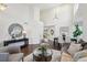 Spacious living room with an open view to the dining area, featuring large windows and stylish decor at 20087 E Dartmouth Dr, Aurora, CO 80013