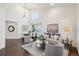 Bright living room and dining area with vaulted ceiling, stylish furniture, and modern decor at 20087 E Dartmouth Dr, Aurora, CO 80013
