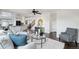 Open-concept living room with stairs and contemporary decor at 20087 E Dartmouth Dr, Aurora, CO 80013