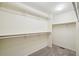 Bright walk-in closet featuring shelving, providing ample storage space for clothing and accessories at 20087 E Dartmouth Dr, Aurora, CO 80013