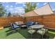 Beautiful backyard with multiple seating areas, covered pergola and mature trees at 2614 E 13Th Ave, Denver, CO 80206