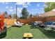 Spacious backyard with artificial turf, lounge chairs, grill and dining set at 2614 E 13Th Ave, Denver, CO 80206