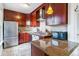 Updated kitchen showcasing modern appliances, granite counters, and stylish cabinetry at 2614 E 13Th Ave, Denver, CO 80206