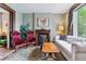 Comfortable living room with decorative fireplace, plush seating, and vintage rug at 2614 E 13Th Ave, Denver, CO 80206