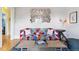 Comfortable living room with a colorful sofa, unique decor, and a cozy atmosphere at 2614 E 13Th Ave, Denver, CO 80206