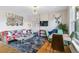 Inviting living and dining area with stylish decor, hardwood floors, and ample natural light at 2614 E 13Th Ave, Denver, CO 80206