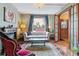 Cozy living room featuring a decorative fireplace, plush seating, and hardwood floors at 2614 E 13Th Ave, Denver, CO 80206