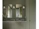 Bathroom with dual mirrors over the vanity and glass enclosed shower at 3330 Bruce Randolph Ave, Denver, CO 80205