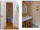 Elegant powder room boasts diamond tile flooring and classic sconce lighting at 3330 Bruce Randolph Ave, Denver, CO 80205