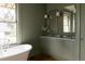 Elegant bathroom with soaking tub, large window, and dual sink vanity at 3330 Bruce Randolph Ave, Denver, CO 80205