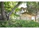 Charming two-story brick home featuring diamond pane windows and a covered porch at 3330 Bruce Randolph Ave, Denver, CO 80205