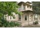 Charming house with detailed window panes and a brick exterior, surrounded by lush greenery at 3330 Bruce Randolph Ave, Denver, CO 80205