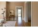 Hallway view, showing a hardwood floor and an open doorway at 3330 Bruce Randolph Ave, Denver, CO 80205