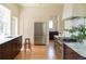 Well lit kitchen with stainless appliances, wood floors and marble countertops at 3330 Bruce Randolph Ave, Denver, CO 80205