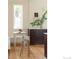 Eat-in kitchen includes a small table with seating and a large window at 3330 Bruce Randolph Ave, Denver, CO 80205