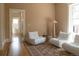 Bright living room features plush seating and a patterned rug at 3330 Bruce Randolph Ave, Denver, CO 80205