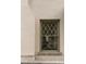 Exterior view of a diamond-patterned window with a brick surround at 3330 Bruce Randolph Ave, Denver, CO 80205