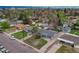 An aerial view of the property surrounded by lush greenery and neighboring houses at 5477 E Asbury Ave, Denver, CO 80222