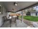 Covered patio area with outdoor seating, perfect for entertaining and relaxing outdoors at 5477 E Asbury Ave, Denver, CO 80222