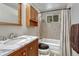 Bathroom featuring wood cabinets, shower and tub combination at 5477 E Asbury Ave, Denver, CO 80222