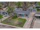Aerial view of a cozy home showcasing its manicured lawn and classic design at 5477 E Asbury Ave, Denver, CO 80222