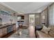 Comfortable living room with a leather couch, hardwood floors, and fireplace at 5477 E Asbury Ave, Denver, CO 80222